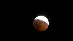 partial lunar eclipse aligns with a supermoon